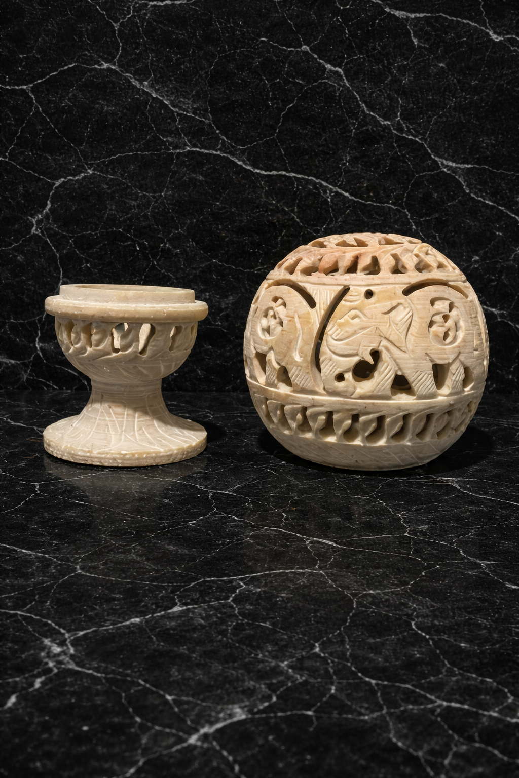 Intricately carved soapstone elephant candle holder