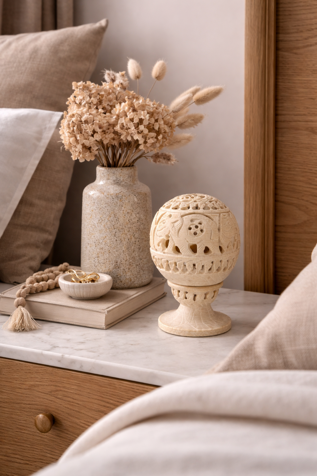 Hand-carved soapstone elephant tealight holder on bedside table