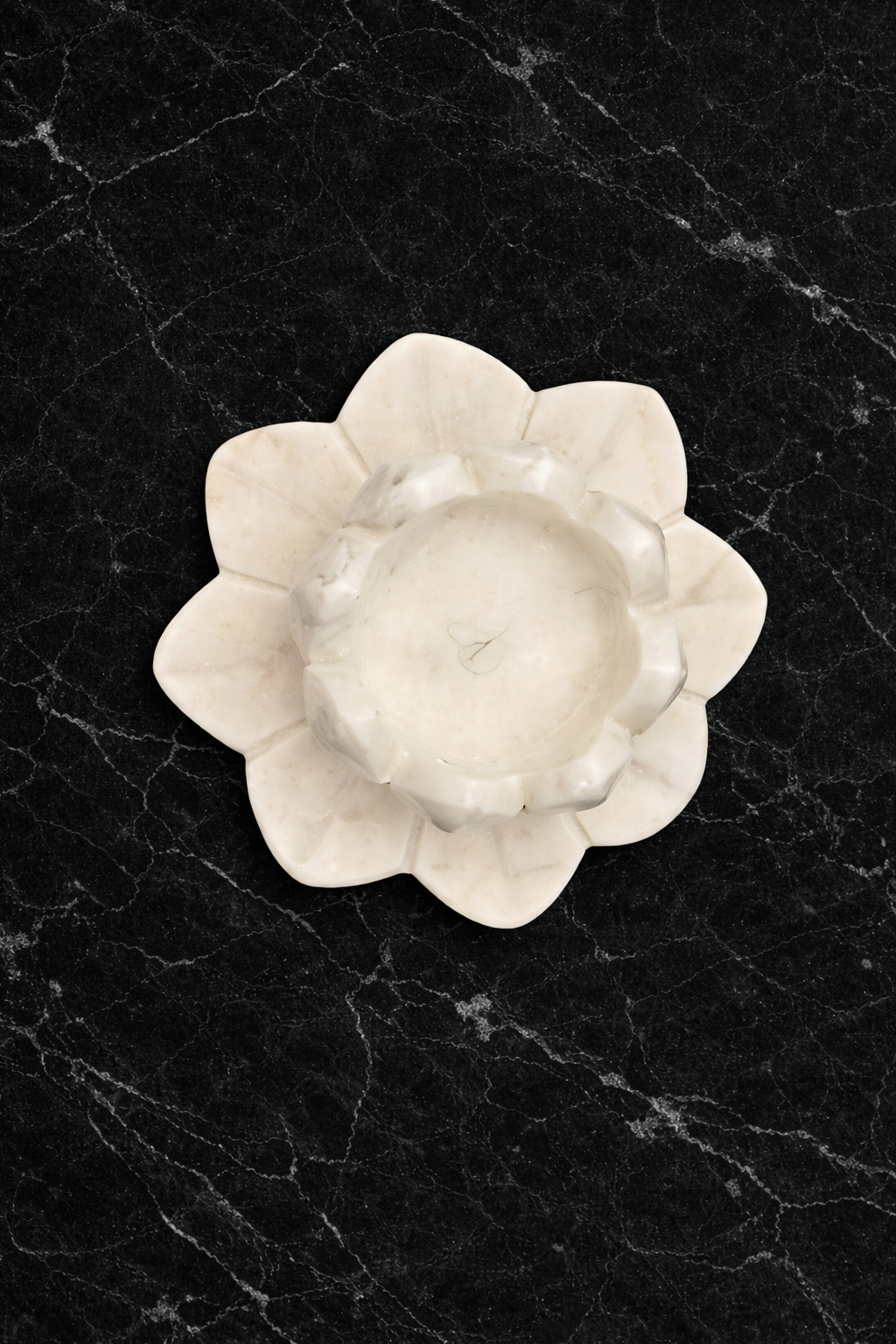 Polished white marble lotus candle holder on black marble table, premium natural stone décor NZ