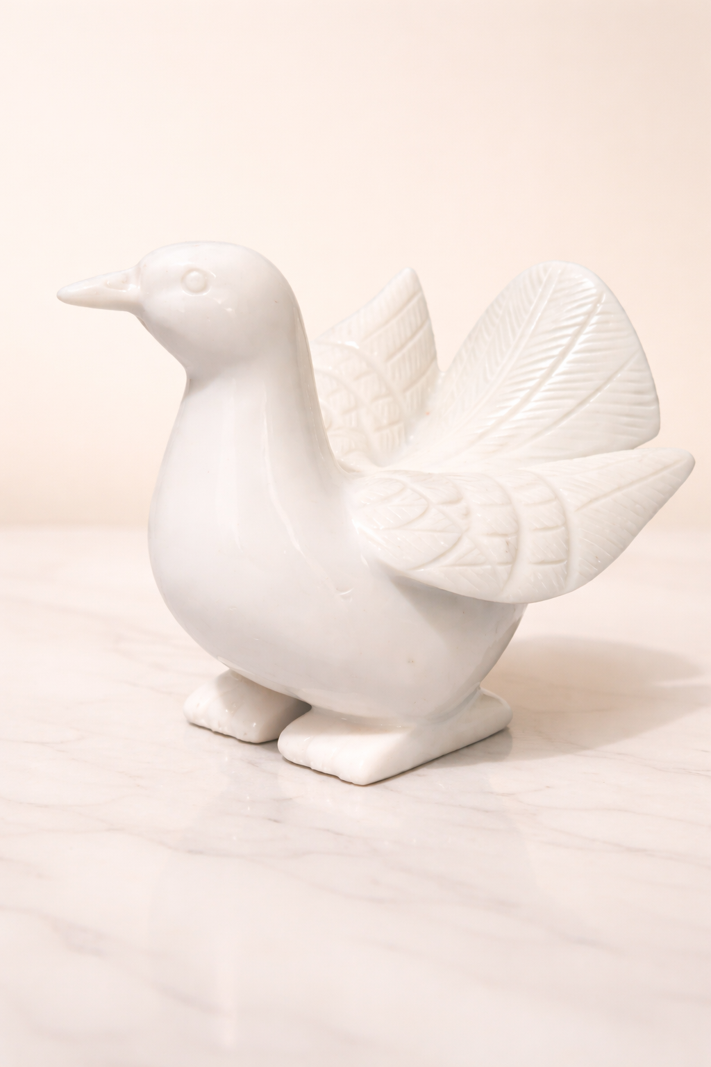 Handcrafted white marble dove sculpture symbolising peace and harmony