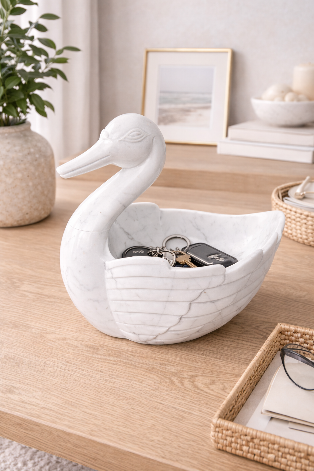 White marble duck bowl used as key holder on entryway console, luxury natural stone décor NZ