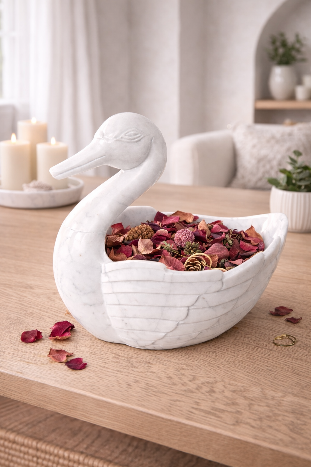 Hand-carved white marble duck bowl filled with dried flowers on wooden table, luxury decorative centrepiece NZ