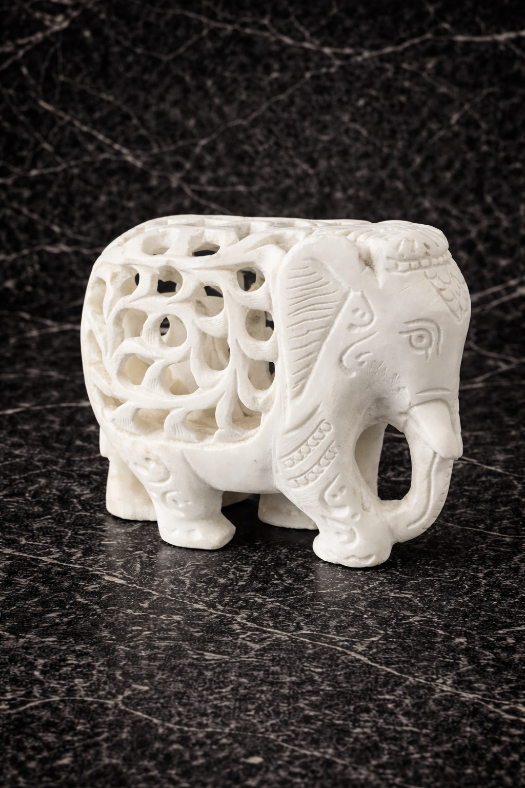 Hand-carved solid marble elephant sculpture with baby inside