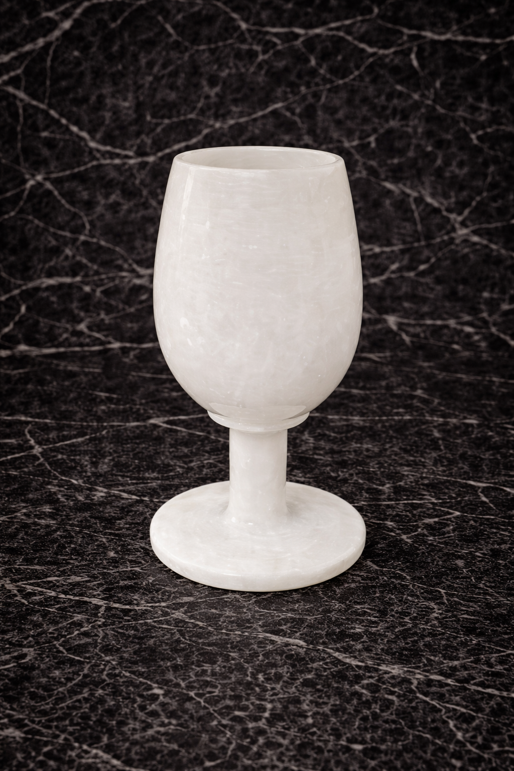 White marble wine glass decor on dark marble surface – hand-carved stone goblet NZ