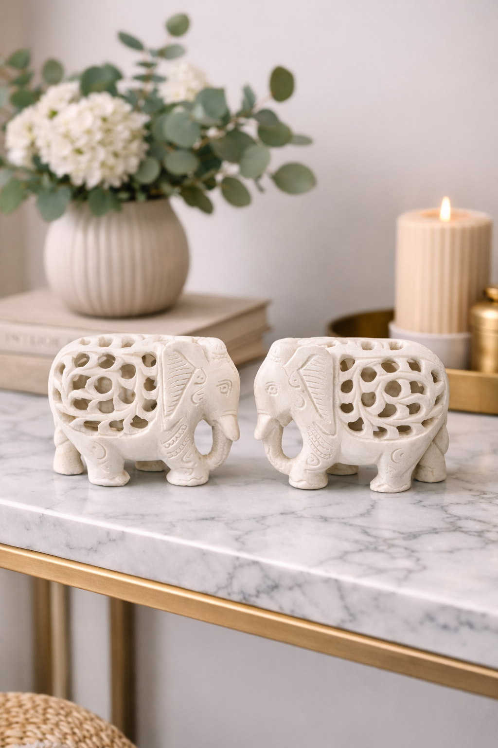 White marble elephant sculpture styled in modern living room setting