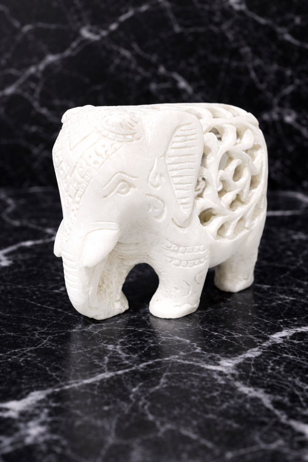 Solid marble elephant figurine with intricate hand-carved detailing