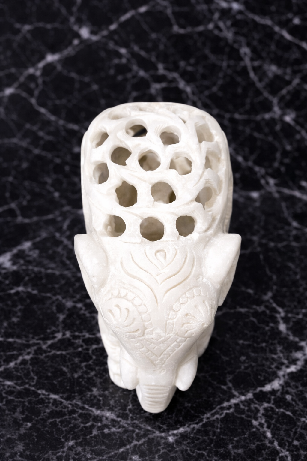 Solid marble elephant figurine with intricate hand-carved detailing