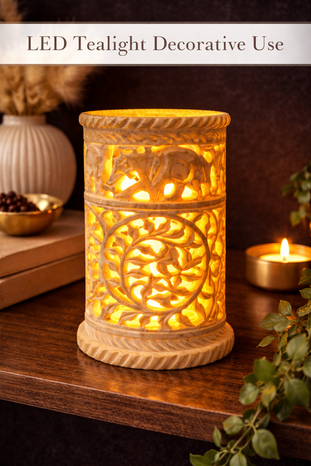 Hand-carved soapstone stand styled with tealight candle for ambient decor