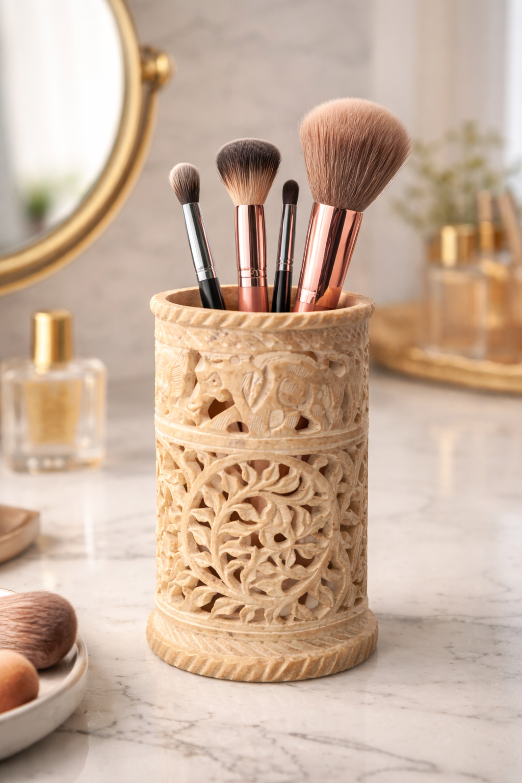 Round soapstone holder used as makeup brush organiser on vanity