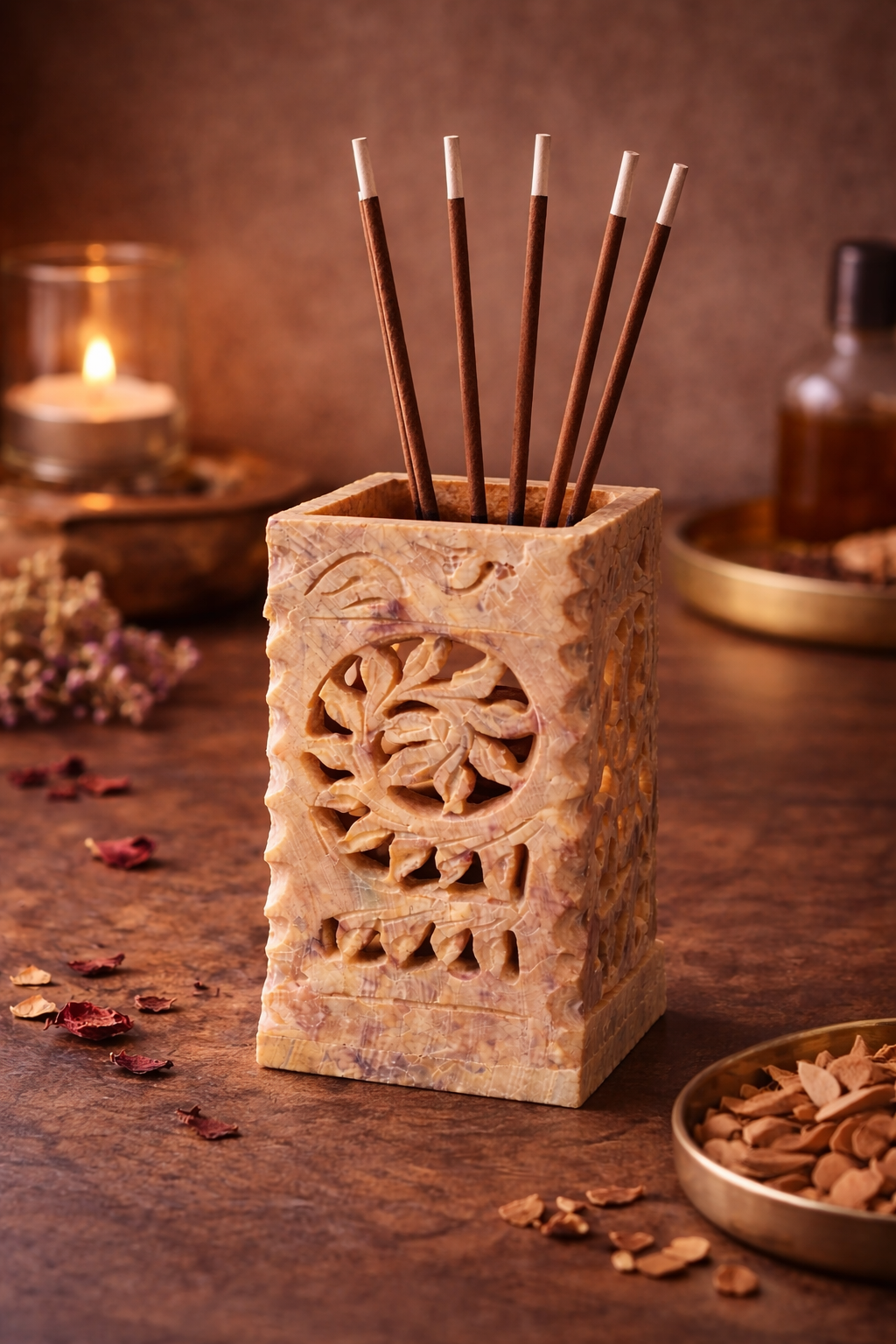 Natural soapstone multipurpose stand holding incense sticks with decorative carved floral pattern.