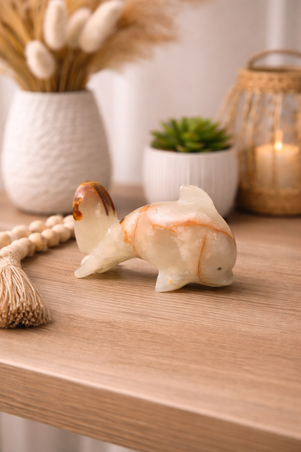 Hand-carved onyx dolphin sculpture styled as living room table centrepiece