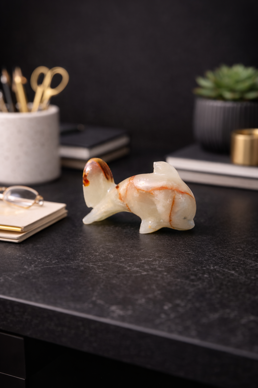 Small onyx dolphin sculpture used as office desk decor accent