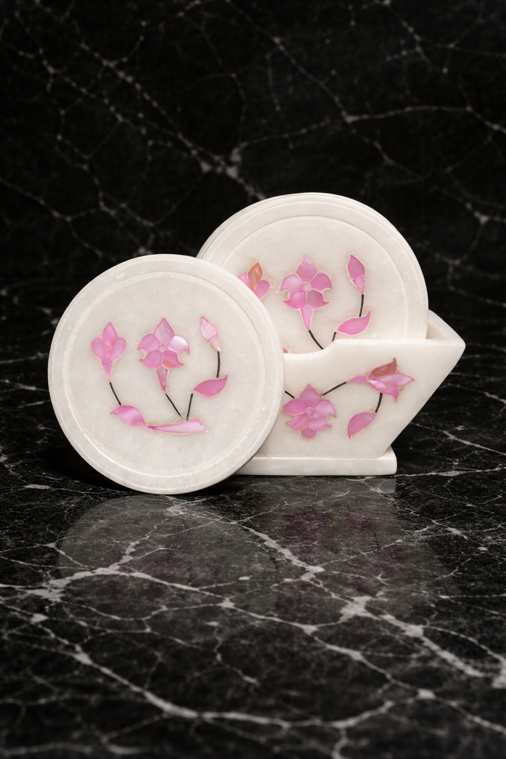 Luxury marble coaster set with pink floral stone inlay on black marble background – handcrafted marble coasters NZ
