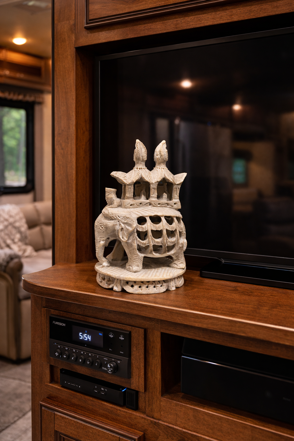 soapstone elephant statue on tv console living room decor nz luxury wooden cabinet styling modern home