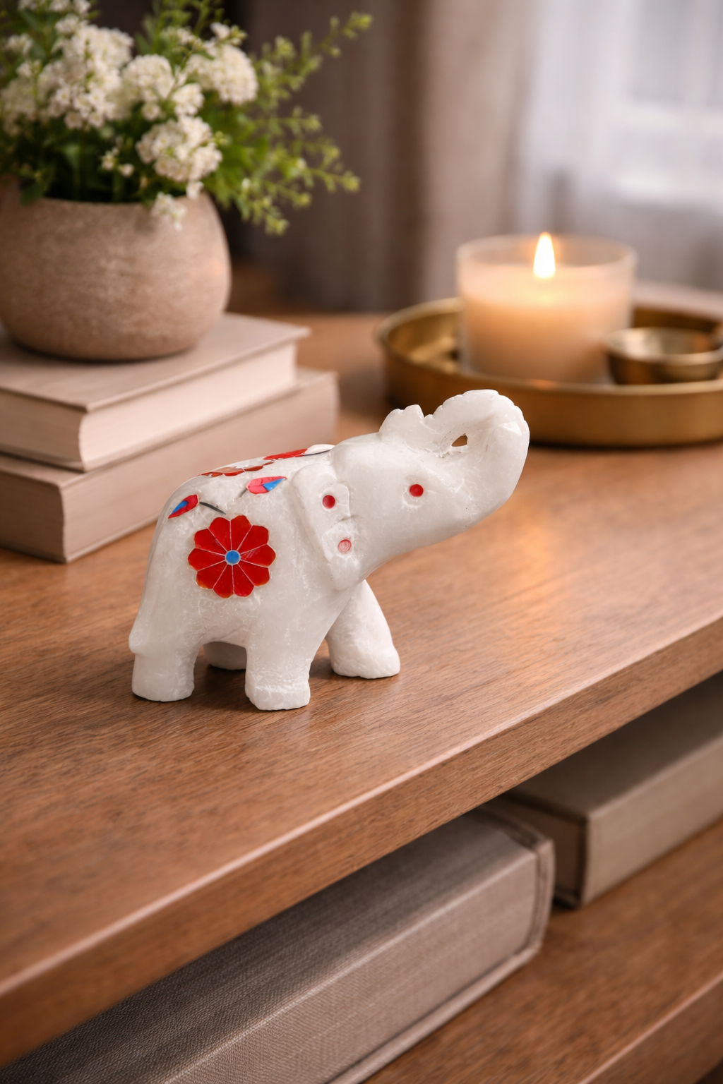 luxury marble elephant figurine close up natural light decor setup