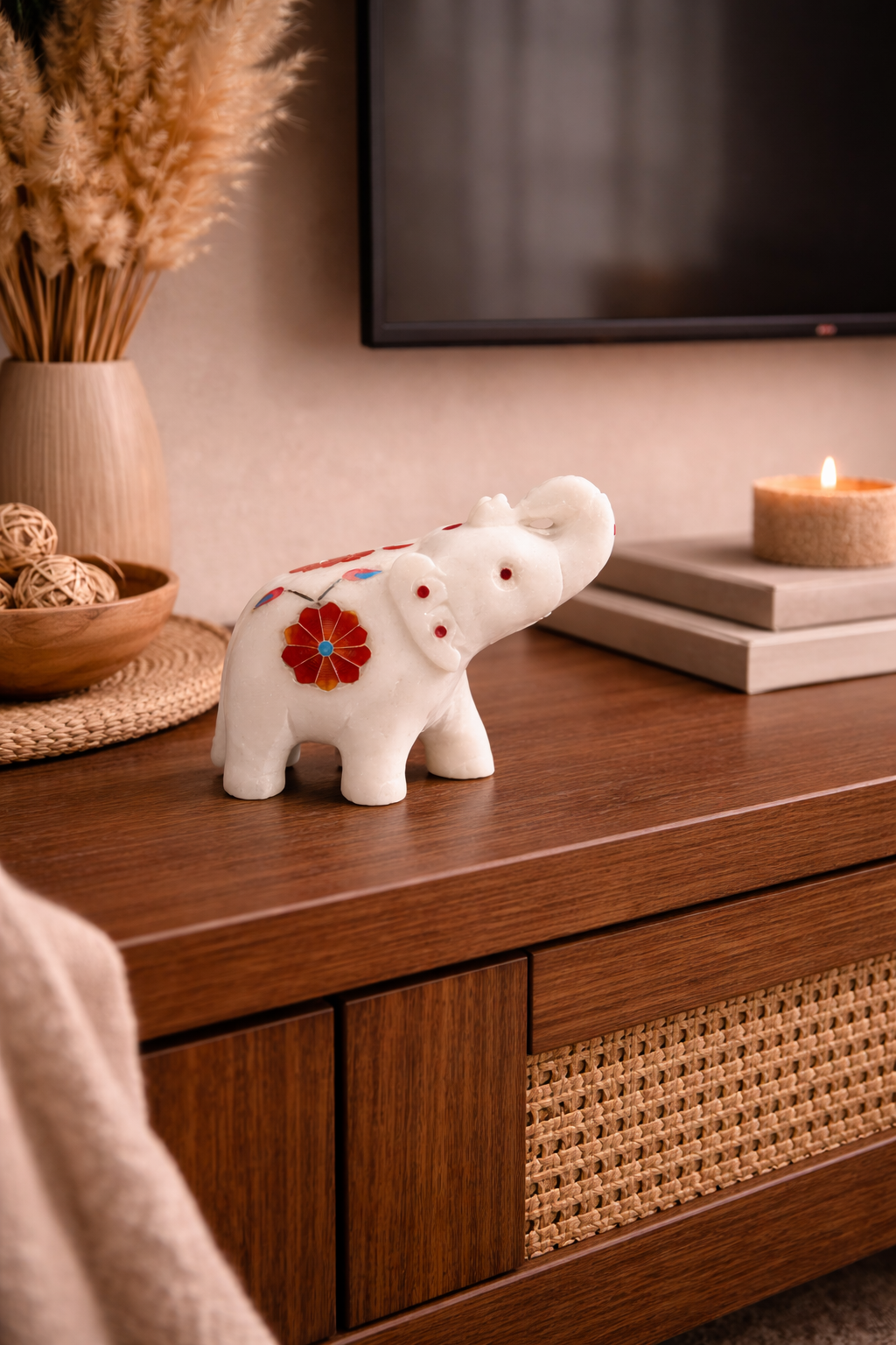 luxury stone elephant decor on wooden TV console aesthetic setup
