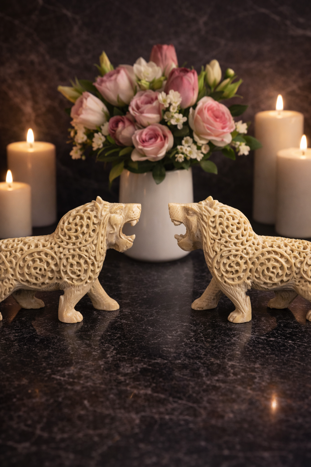 pair of soapstone lion statues facing each other with candles and flower vase luxury entryway decor nz