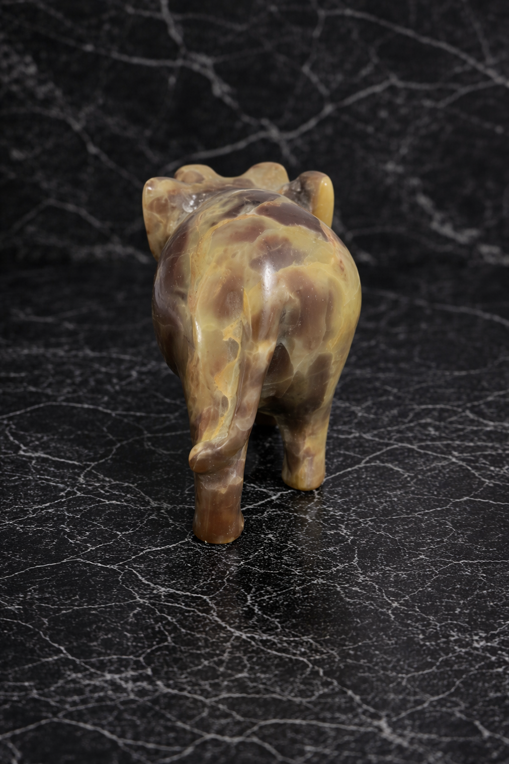 Rare view of modern home decor elephant figurine neutral marble background