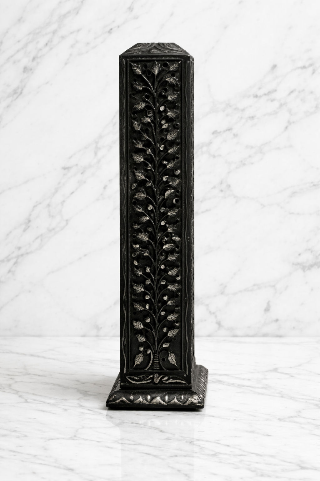 black stone tealight holder with leaf carving on white marble background NZ luxury decor
