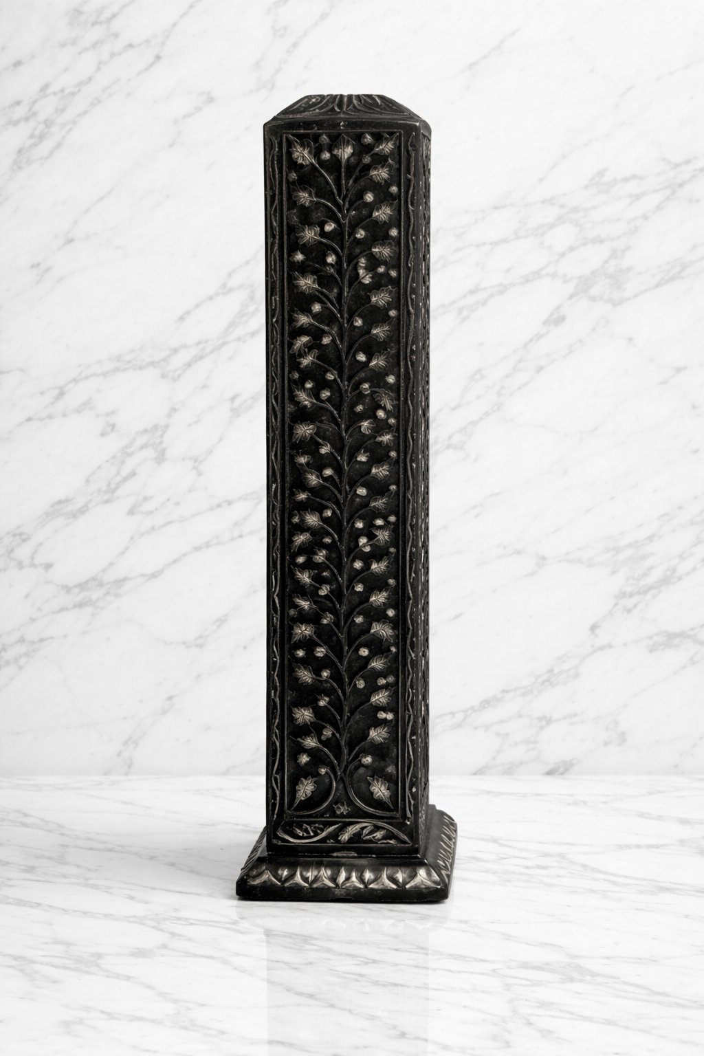 close up of black stone candle holder with intricate leaf design carving luxury decor NZ