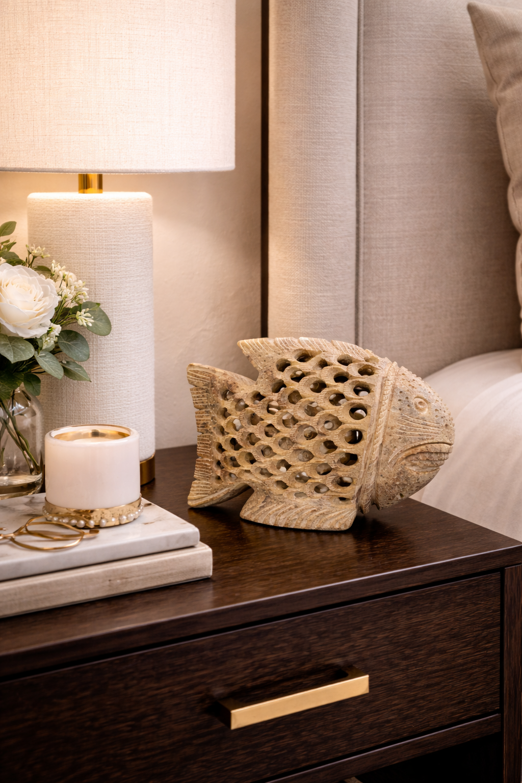 Hand-carved soapstone fish sculpture on bedside table, luxury natural stone home décor