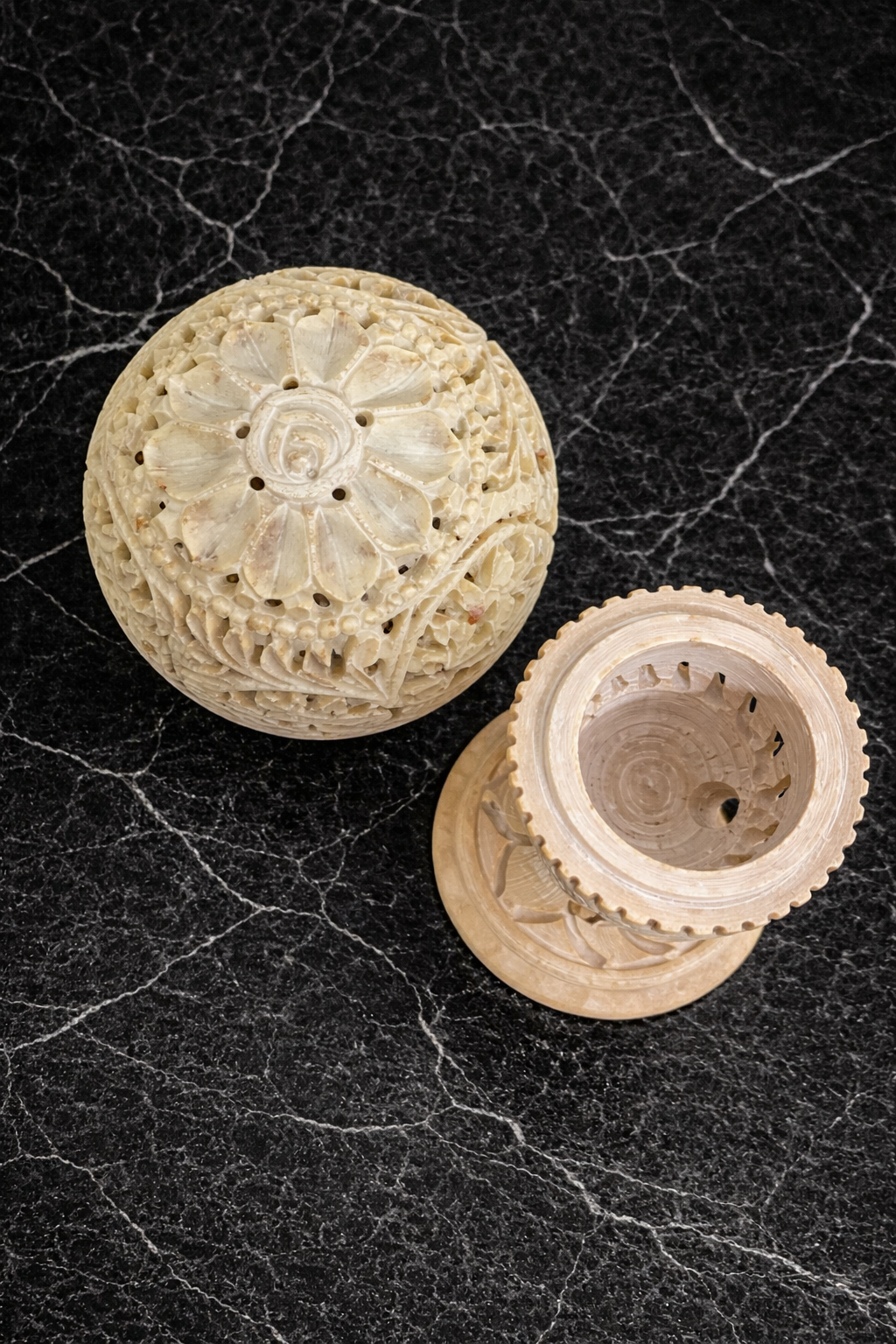 top view soapstone tealight holder floral carving detail handcrafted stone candle holder intricate pattern decor