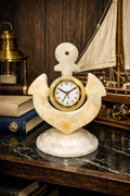 onyx anchor desk clock displayed on black marble table with nautical décor including books, lantern, and sailboat model.