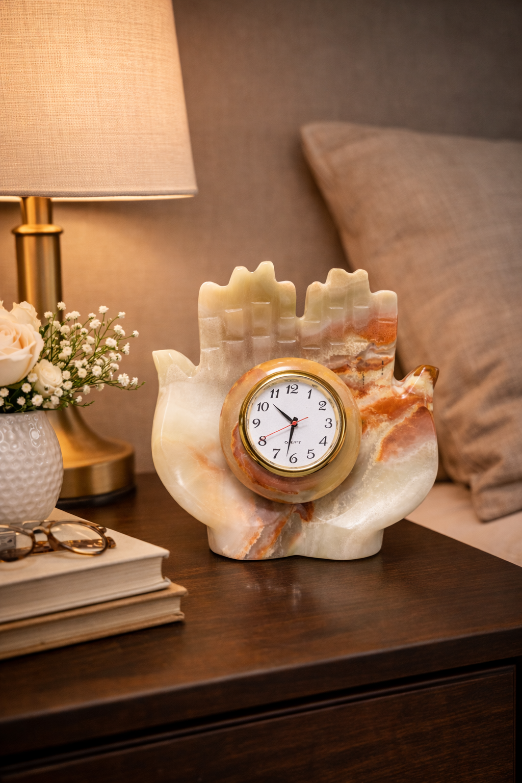 Hand carved natural onyx hand shaped bedside table clock luxury stone décor with warm bedroom styling