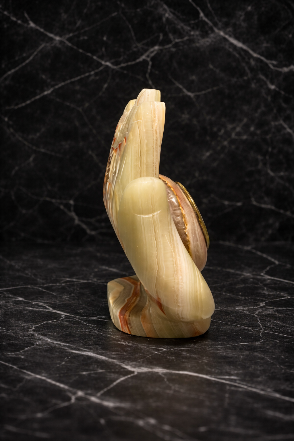 side view of onyx hand shaped clock luxury stone décor