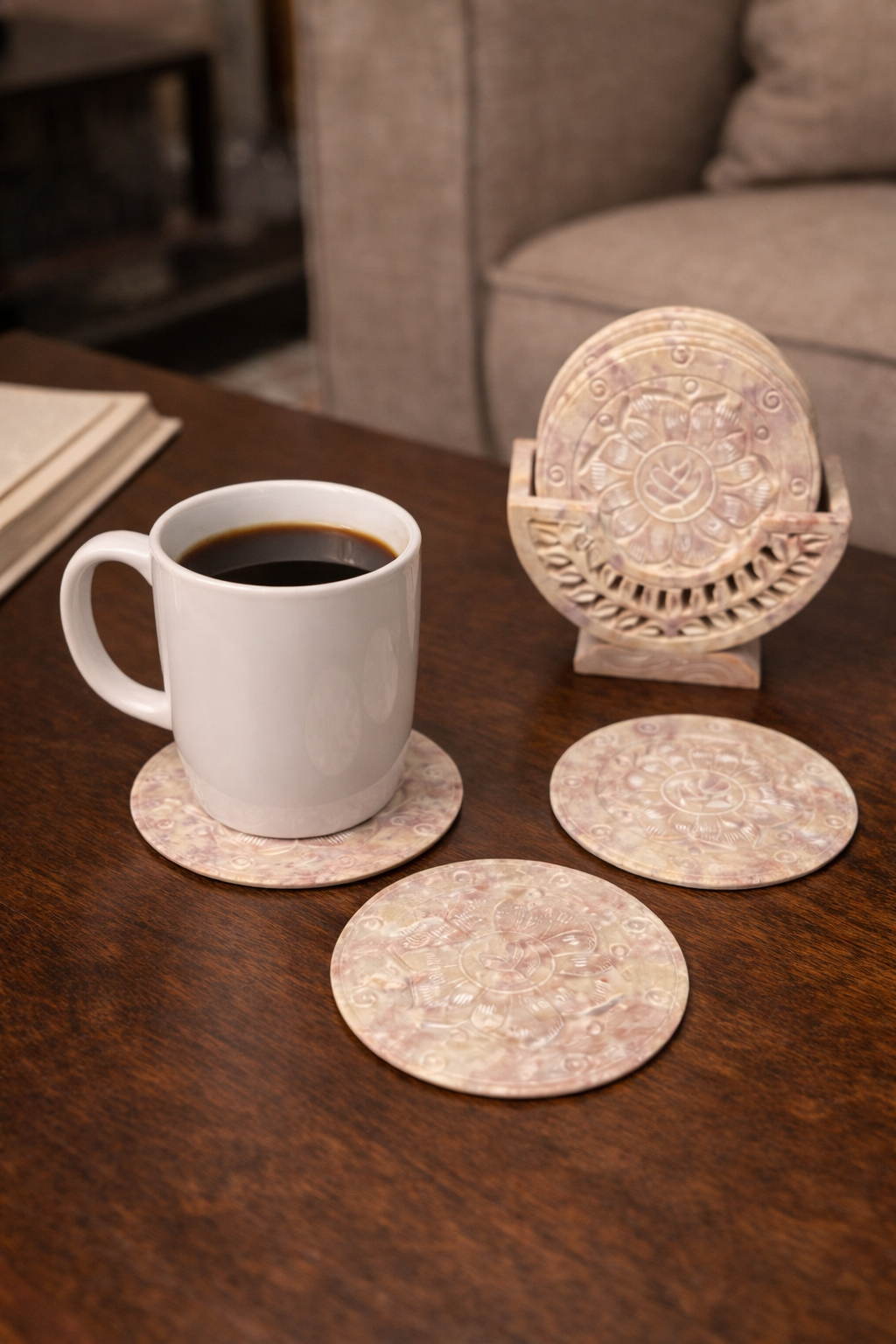 Elegant soapstone lotus coasters displayed on coffee table décor