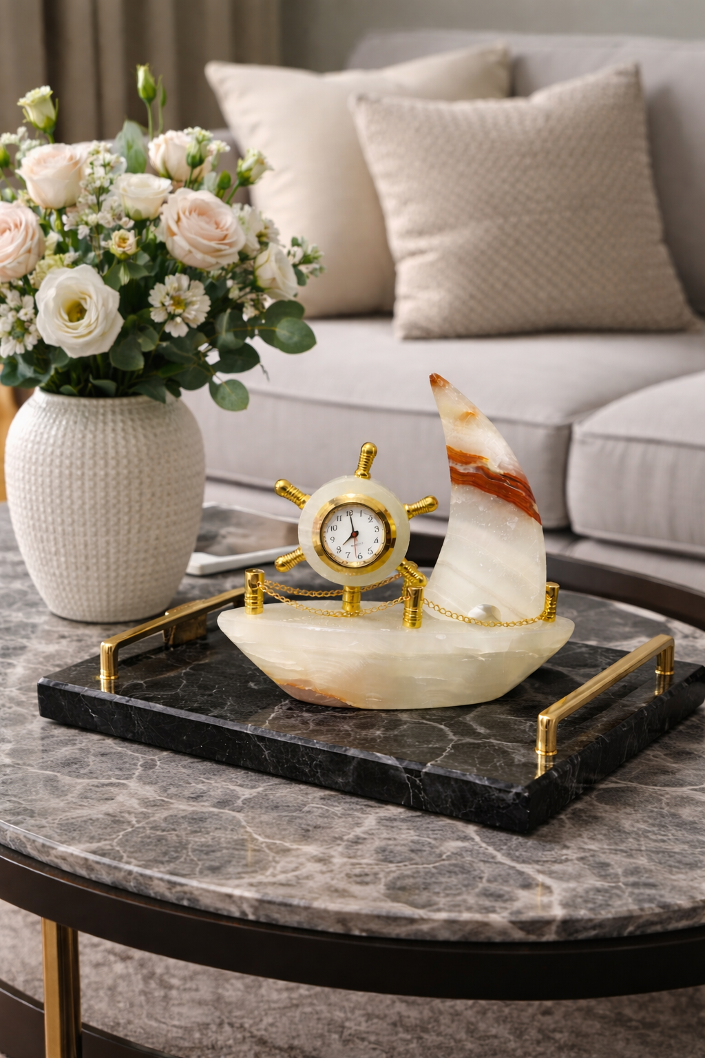 Luxury onyx sailboat clock centerpiece on entry console with candles and mirror, modern home decor