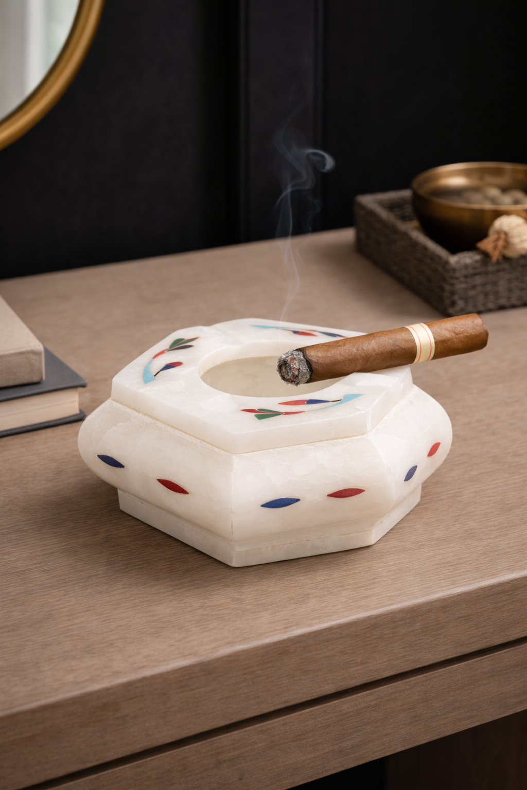 Luxury cigar lounge decor featuring premium marble cigar ashtray with lit cigar