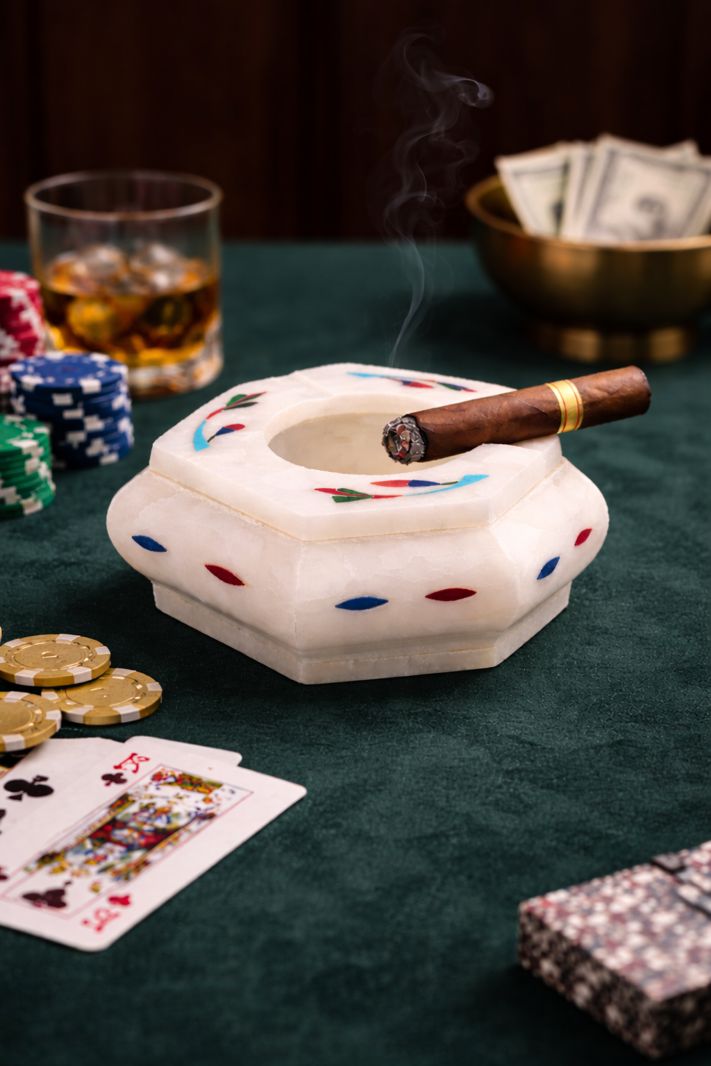 Handcrafted marble cigar ashtray with cigar smoke on poker table luxury cigar lounge decor