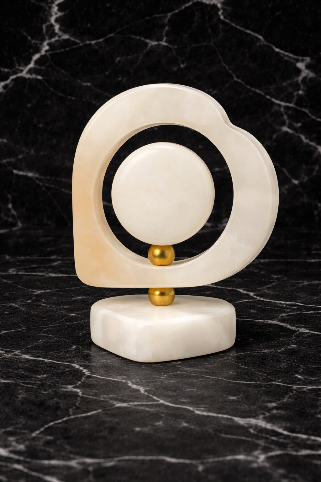rare view of heart-shaped onyx desk clock on black marble background – modern marble table clock décor for luxury home interiors.
