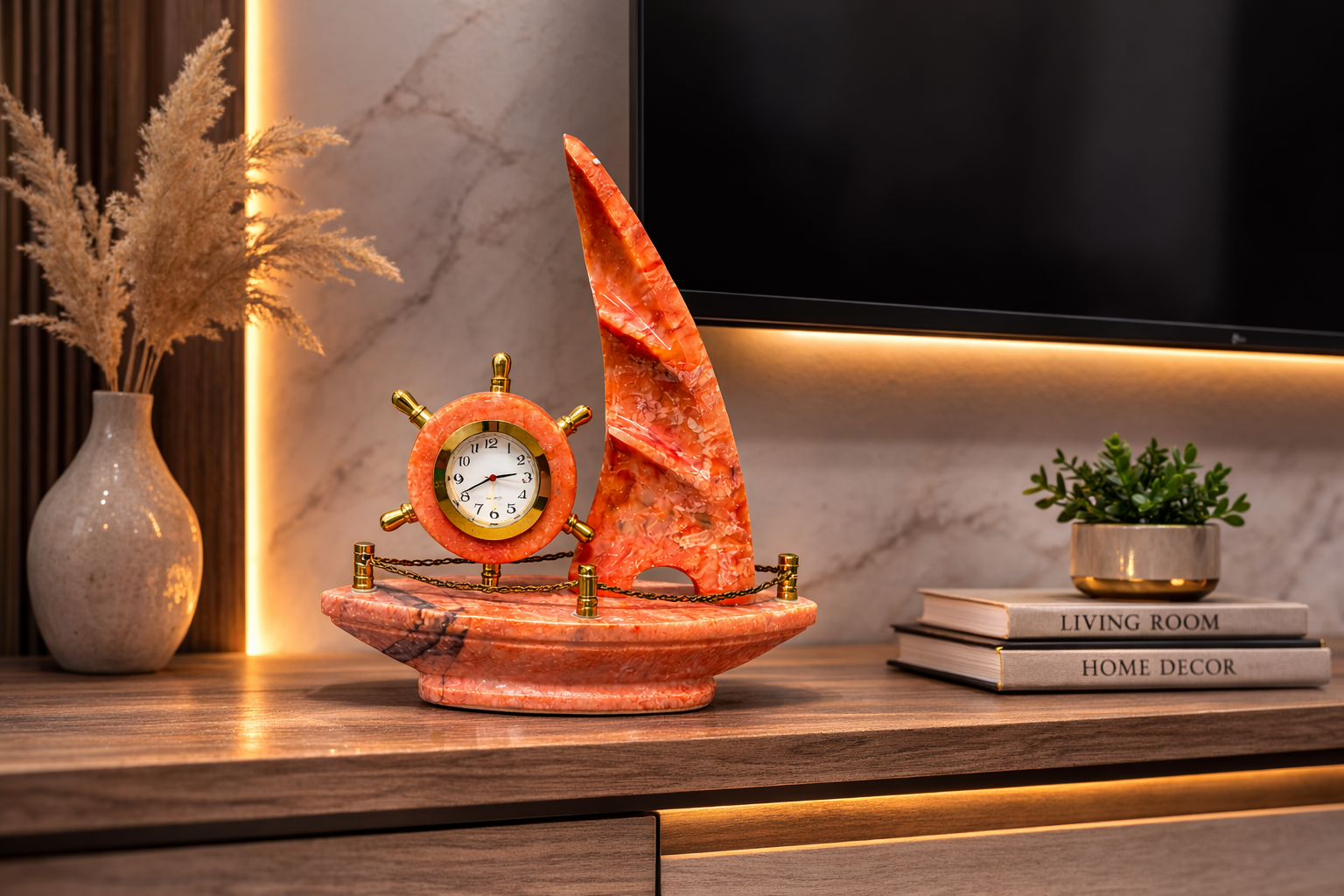 Decorative red onyx sailboat desk clock placed on TV stand – nautical marble décor for modern living rooms.
