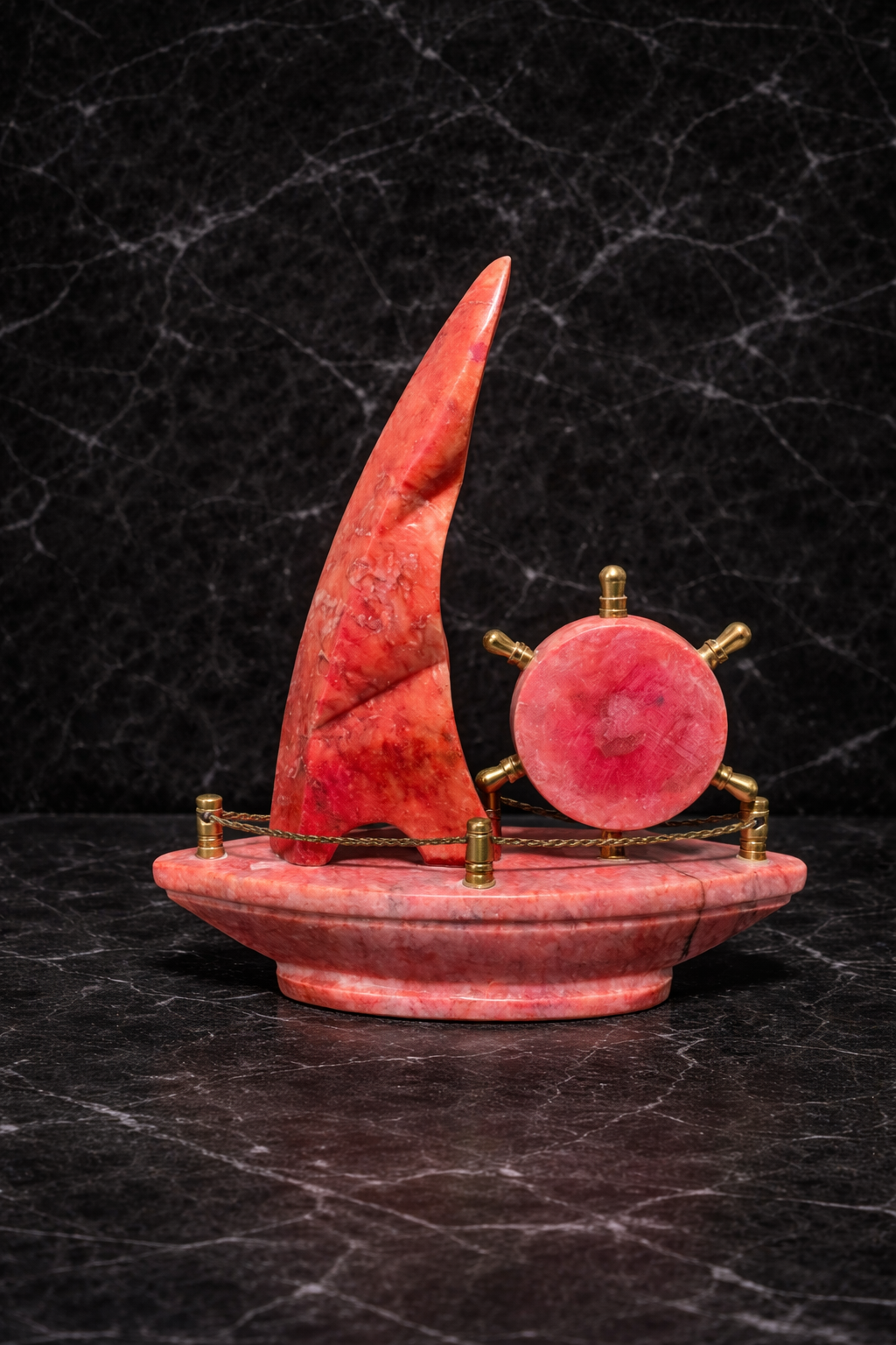 rare view of handcrafted red onyx sailboat onyx desk clock showing natural stone texture and nautical design.
