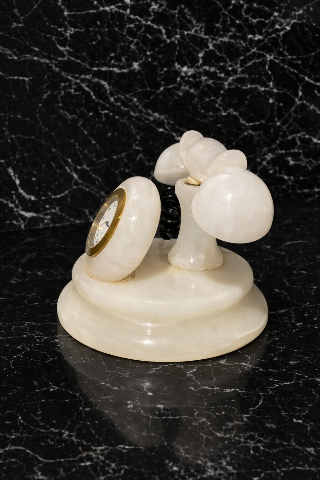 Side view of luxury onyx desk clock vintage phone style stone decor