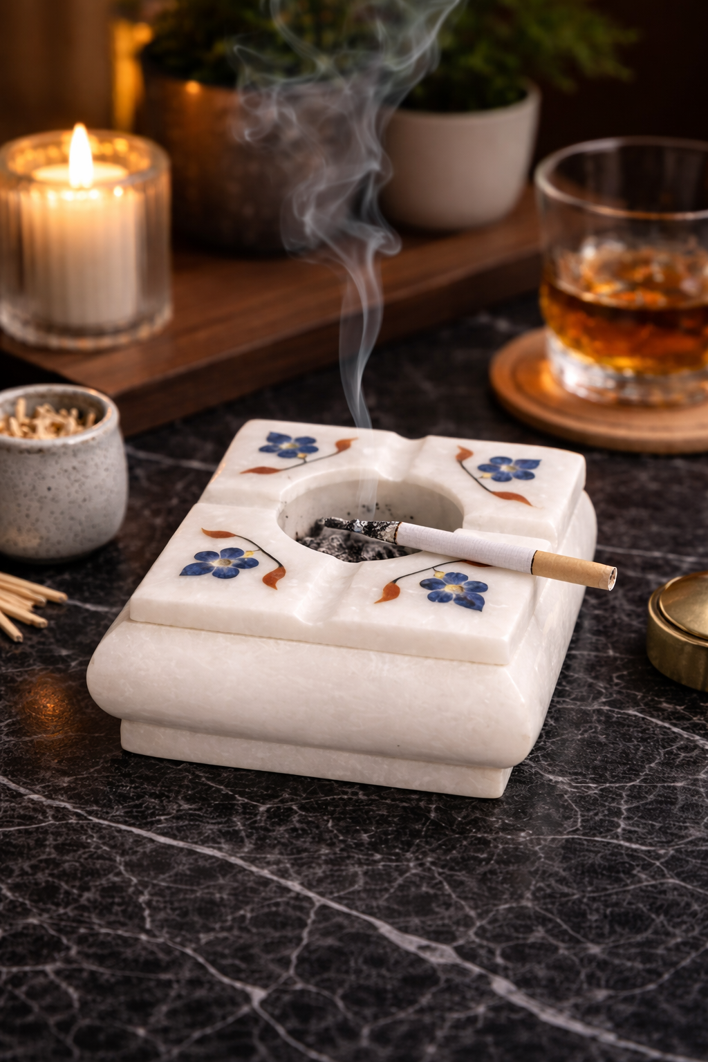 Handcrafted marble cigar ashtray with floral multistone inlay on black marble bar table