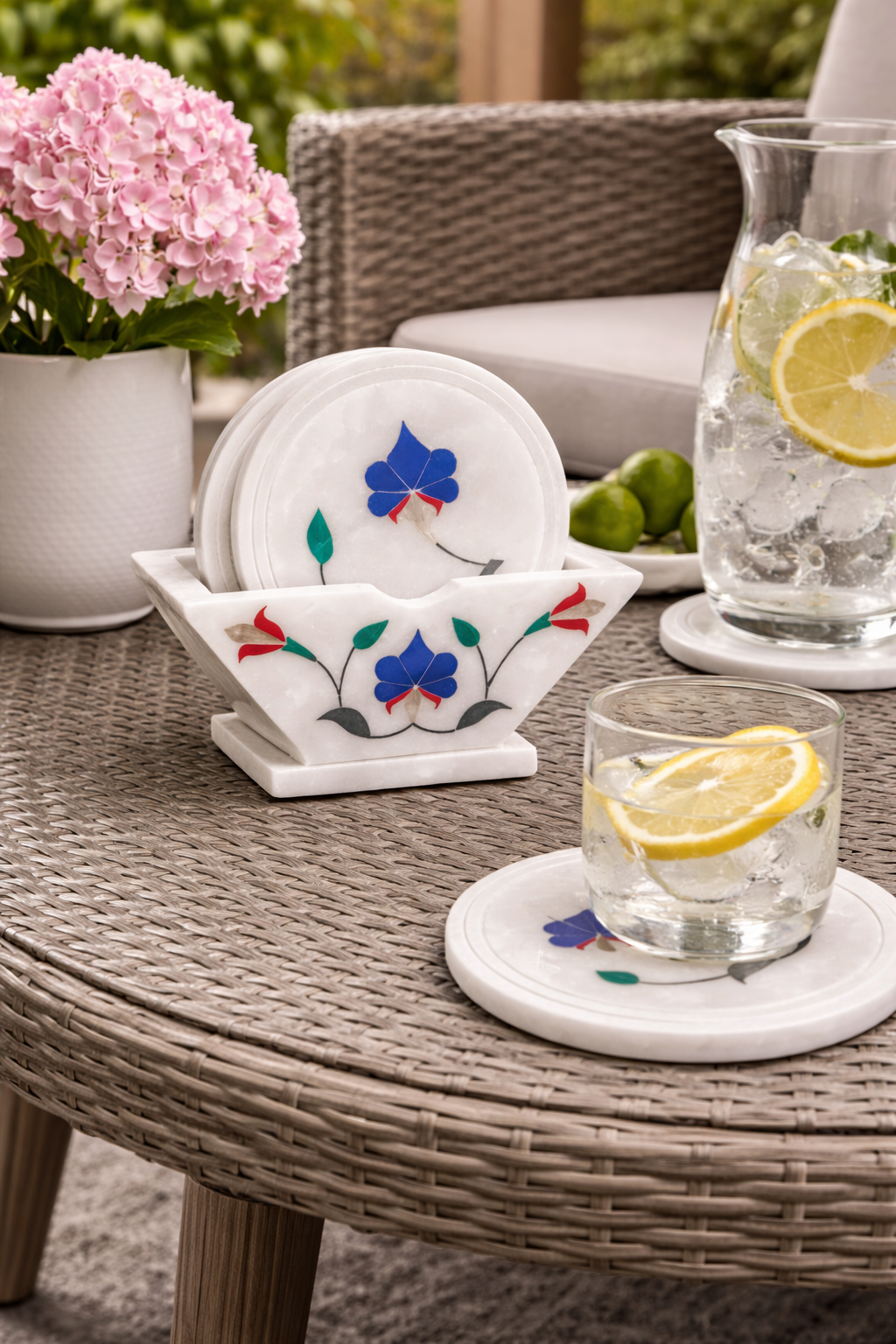 Luxury marble coaster set with multicolour stone inlay used on outdoor lounge table – natural stone drink coasters