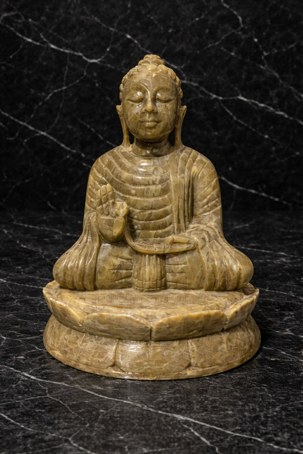 Hand-carved polished soapstone Buddha statue seated on lotus base, natural stone figurine for meditation and spiritual home décor in NZ.