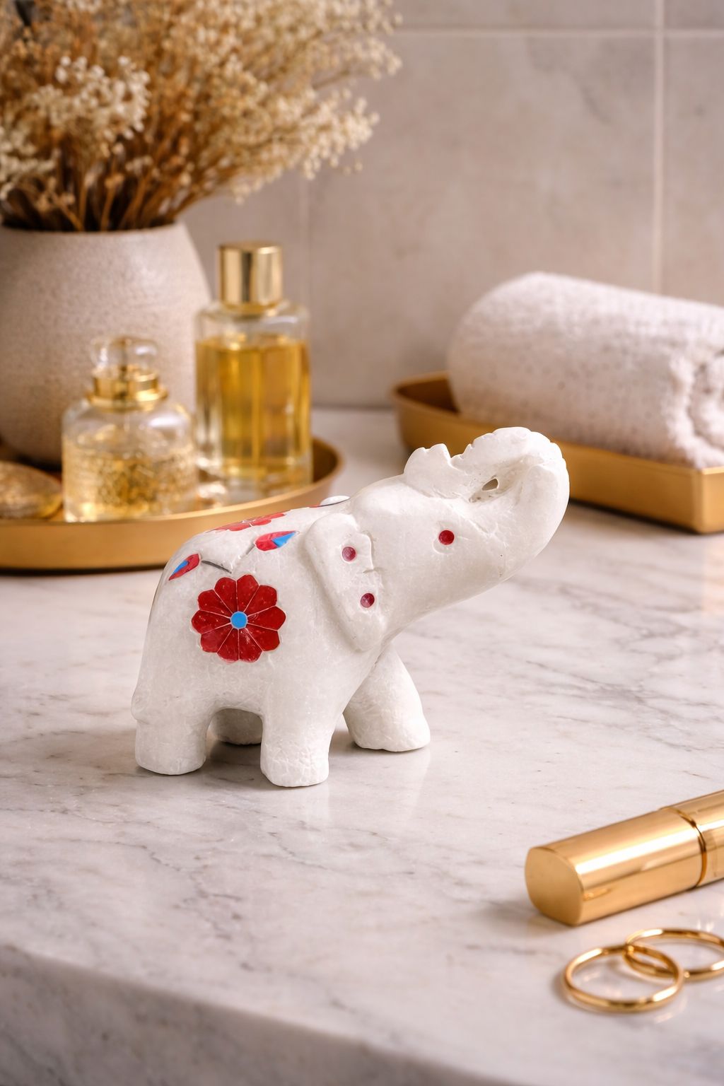 white marble elephant decor with red floral inlay on vanity table luxury home styling NZ
