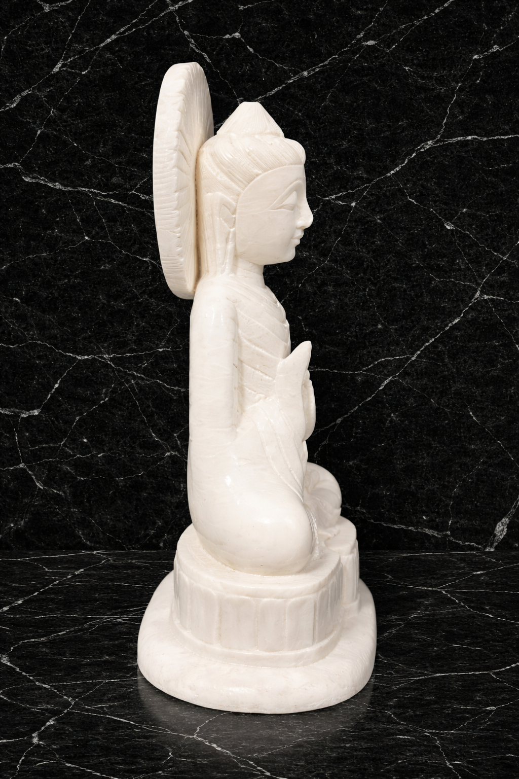 Hand-carved solid white marble Buddha statue with circular halo design, polished natural stone sculpture.