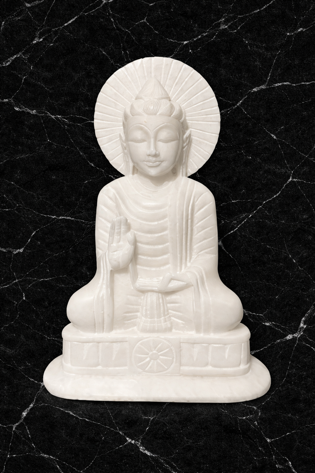 White marble Buddha statue on a black marble background.