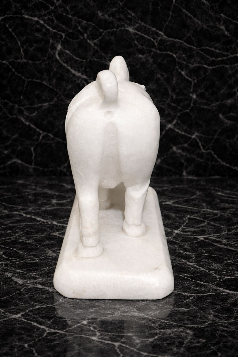 Rare view of elegant marble bull statue placed on polished marble base