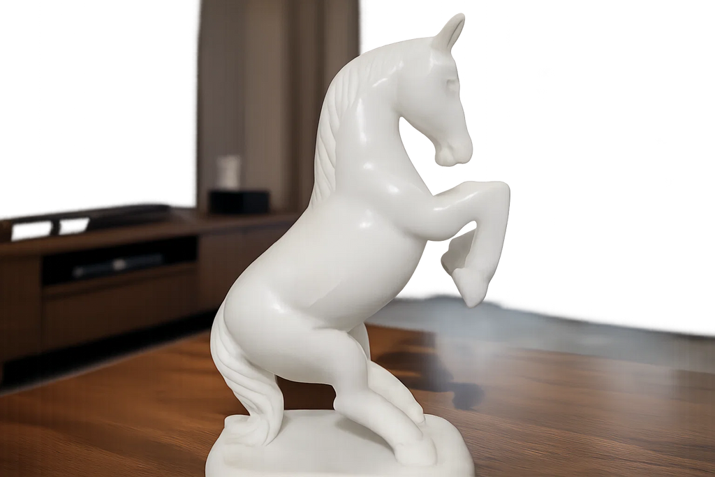 Handcrafted white marble horse figurine styled with candles and neutral interior décor